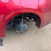 Brake assembly exposed during a vehicle repair