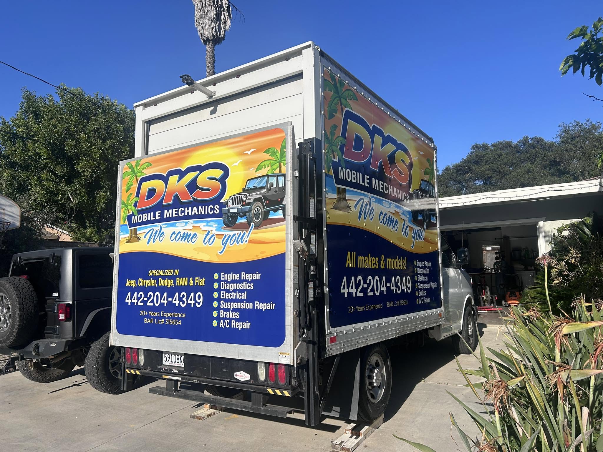 DKS Mobile Mechanics service truck parked outside the workshop